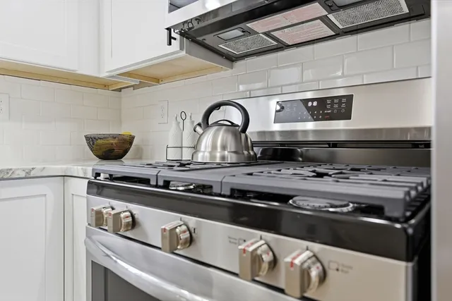 a view of a kitchen sink and a window