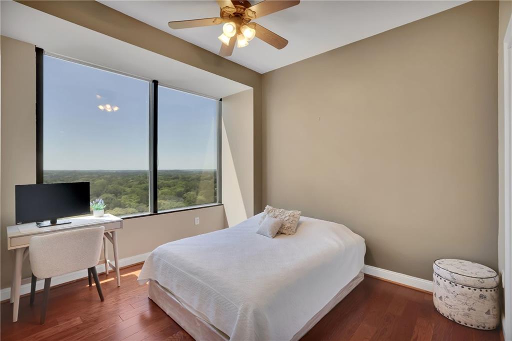 2828 Peachtree Road Northwest, Unit 1901 Atlanta, GA 30305 - Photo 23 of 35 a bedroom with a bed and a window