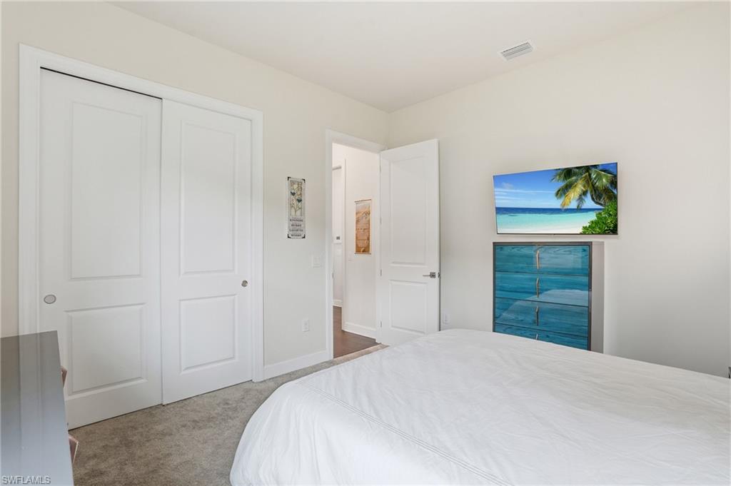 19696 Aqua View Lane Fort Myers, FL 33913 - Photo 23 of 50 a bedroom with a bed and a shower