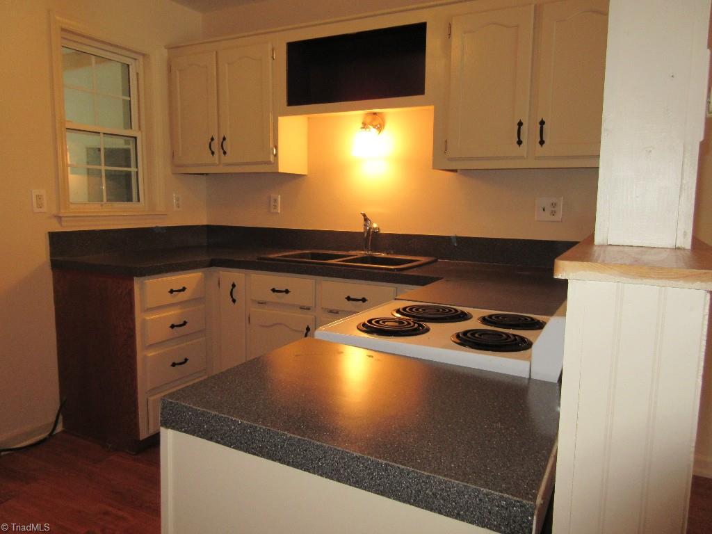 245 Hampton Road, Unit 3B Asheboro, NC 27203 - Photo 3 of 18 Freshly painted cabinets, new counter top. Space saving range and dishwasher.