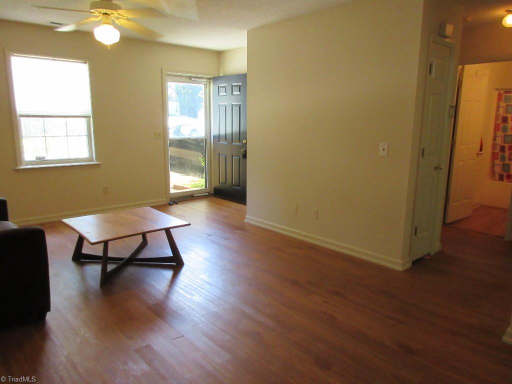 245 Hampton Road, Unit 3B Asheboro, NC 27203 - Photo 4 of 18 Open living area view from dining area, laminate floors fresh and clean!