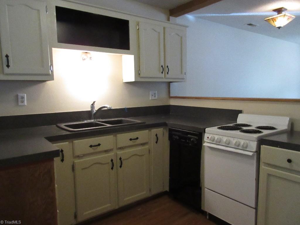 245 Hampton Road, Unit 3B Asheboro, NC 27203 - Photo 5 of 18 Compact, but efficient kitchen half open to dining area.