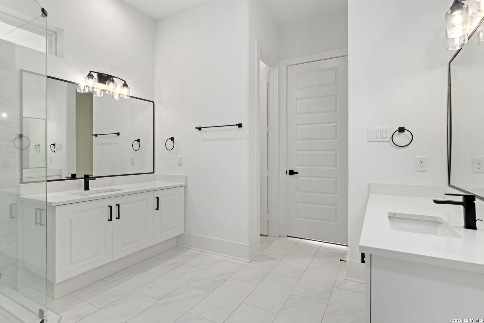 1054 Star Ridge Spring Branch, TX 78070 - Photo 15 of 31 a spacious bathroom with a double vanity sink a mirror and a shower