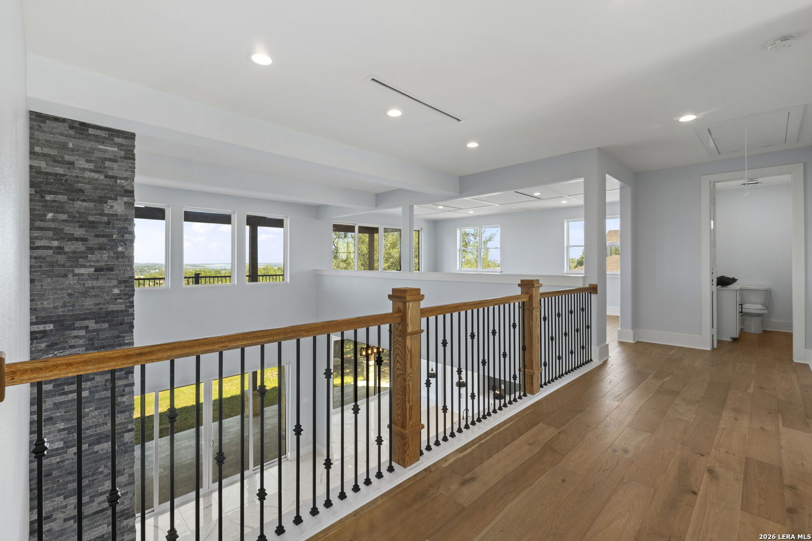 1054 Star Ridge Spring Branch, TX 78070 - Photo 19 of 31 a view of a porch with wooden floor and windows