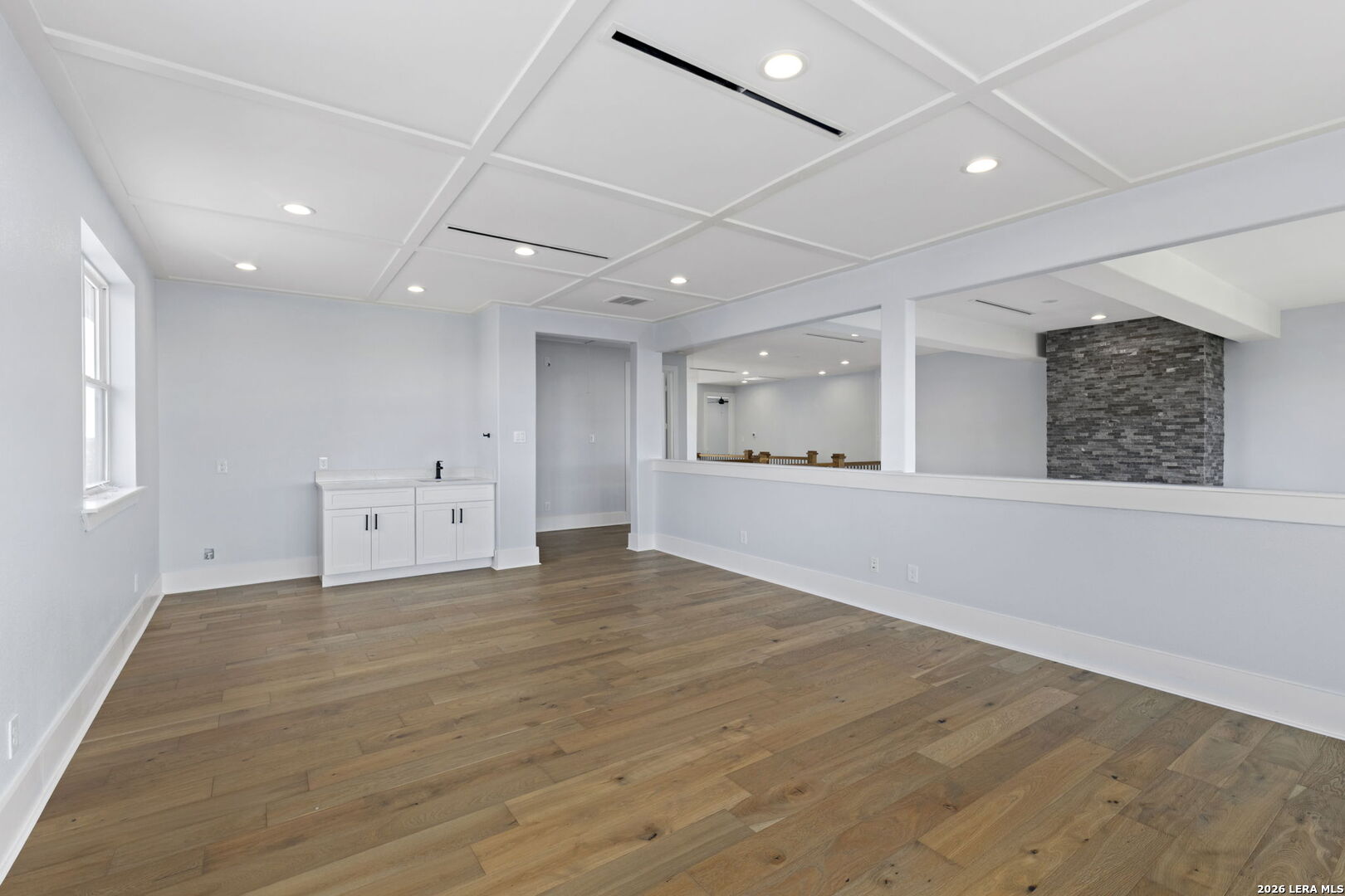 1054 Star Ridge Spring Branch, TX 78070 - Photo 20 of 31 a view of an empty room with wooden floor and a window