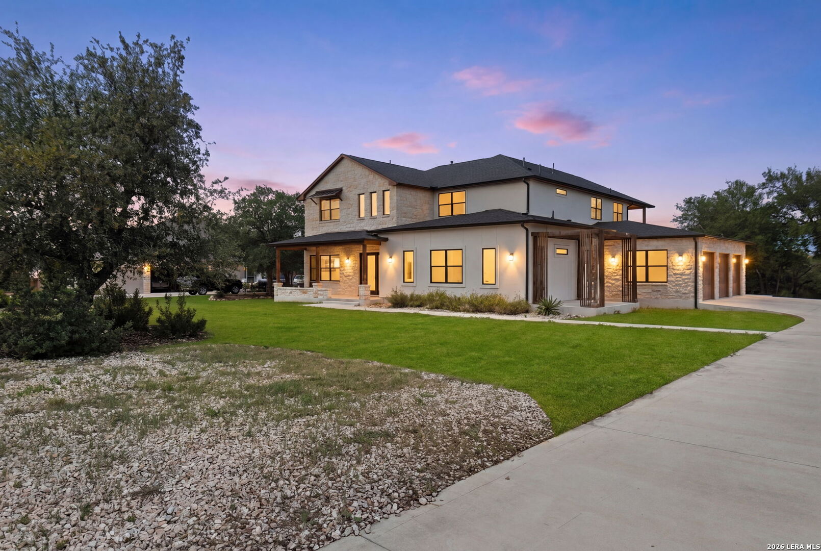 1054 Star Ridge Spring Branch, TX 78070 - Photo 2 of 31 a front view of a house with a yard