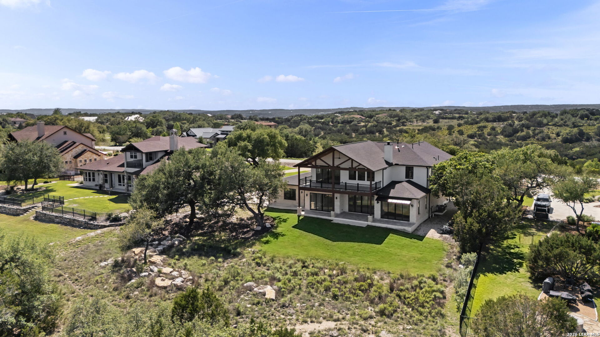 1054 Star Ridge Spring Branch, TX 78070 - Photo 24 of 31 an aerial view of a house with a garden and lake view