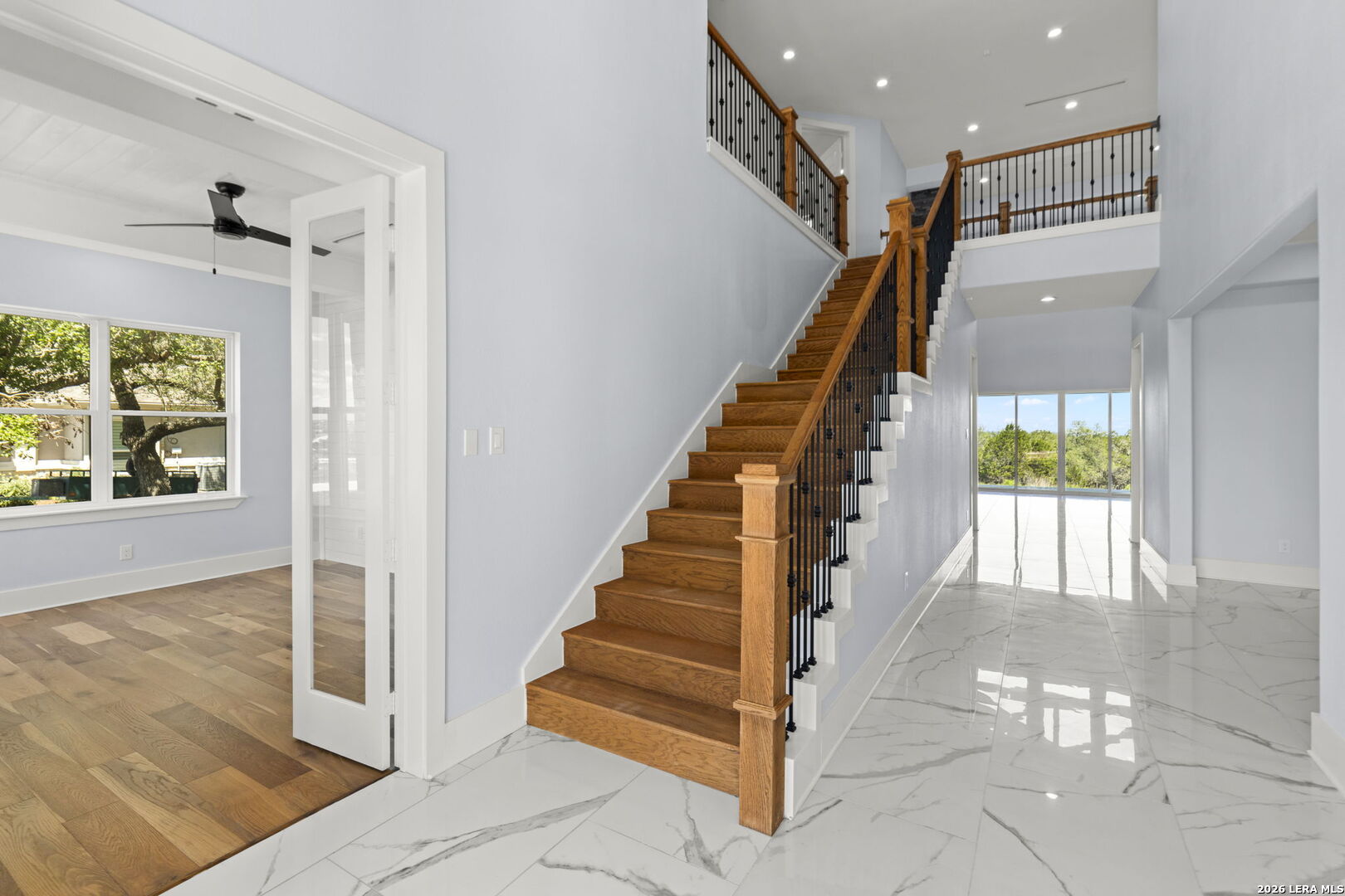 1054 Star Ridge Spring Branch, TX 78070 - Photo 3 of 31 a view of staircase with white walls and windows