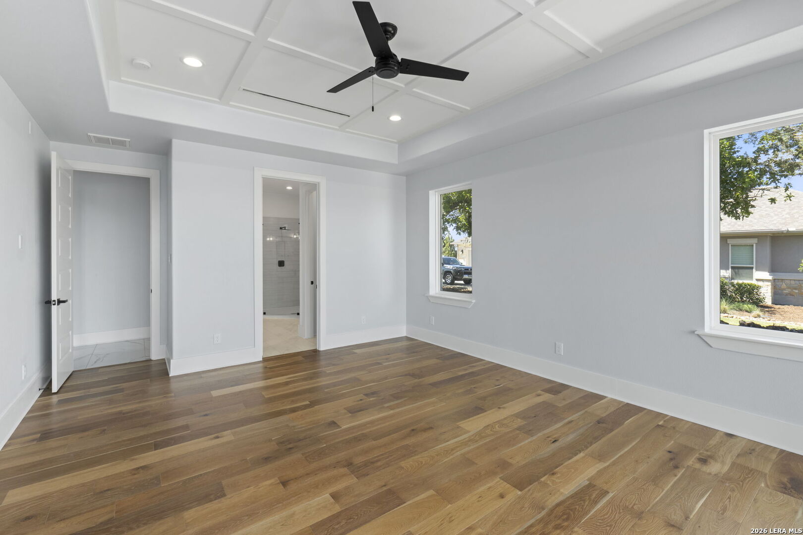 1054 Star Ridge Spring Branch, TX 78070 - Photo 6 of 31 wooden floor in an empty room with a window