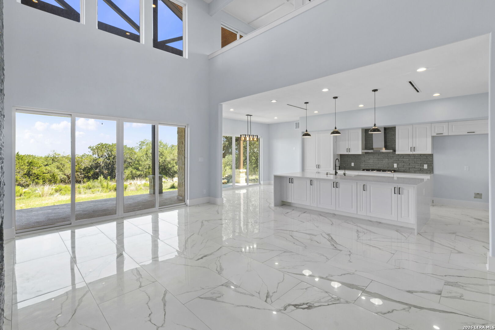 1054 Star Ridge Spring Branch, TX 78070 - Photo 9 of 31 a large white kitchen with a large window