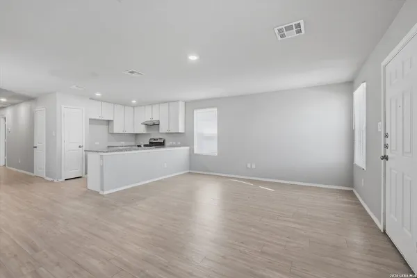 a view of kitchen with wooden floor