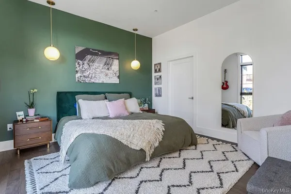 a bedroom with a large bed and a couch