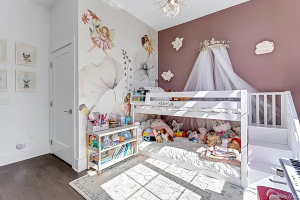a living room with furniture a window and a ceiling fan