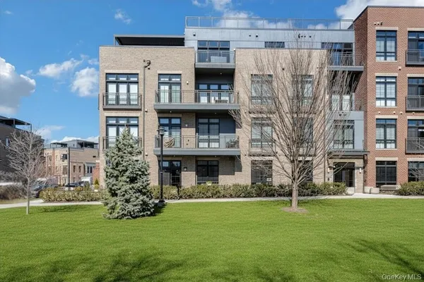 a front view of a house with outdoor seating