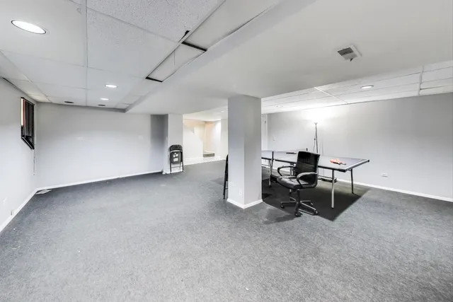 a view of a big room with windows