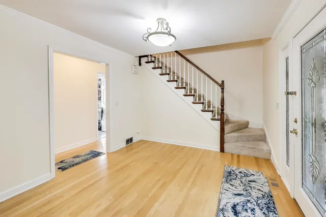 a view of a hallway view with staircase