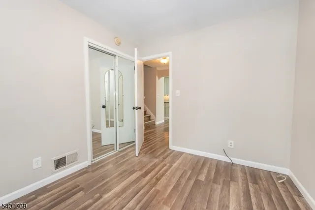 a view of a livingroom with wooden floor