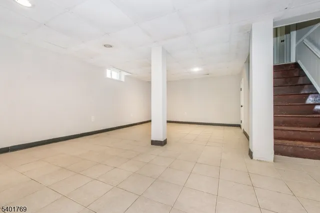 a view of an empty room with stairs