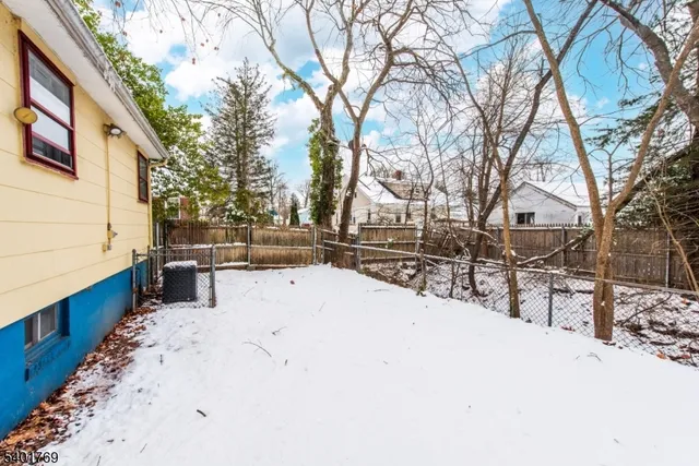 a view of street with snow on the road