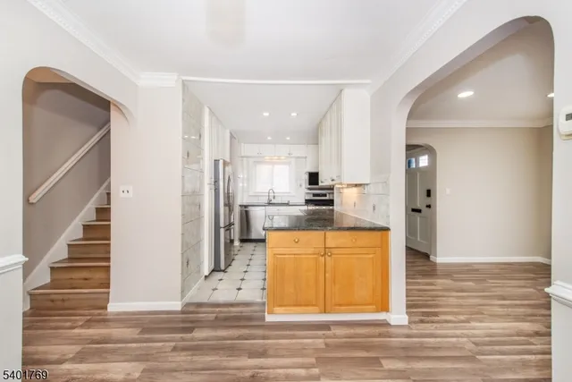 a view of kitchen with wooden floor