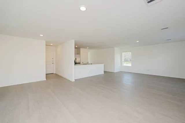 a kitchen with a sink stove and refrigerator