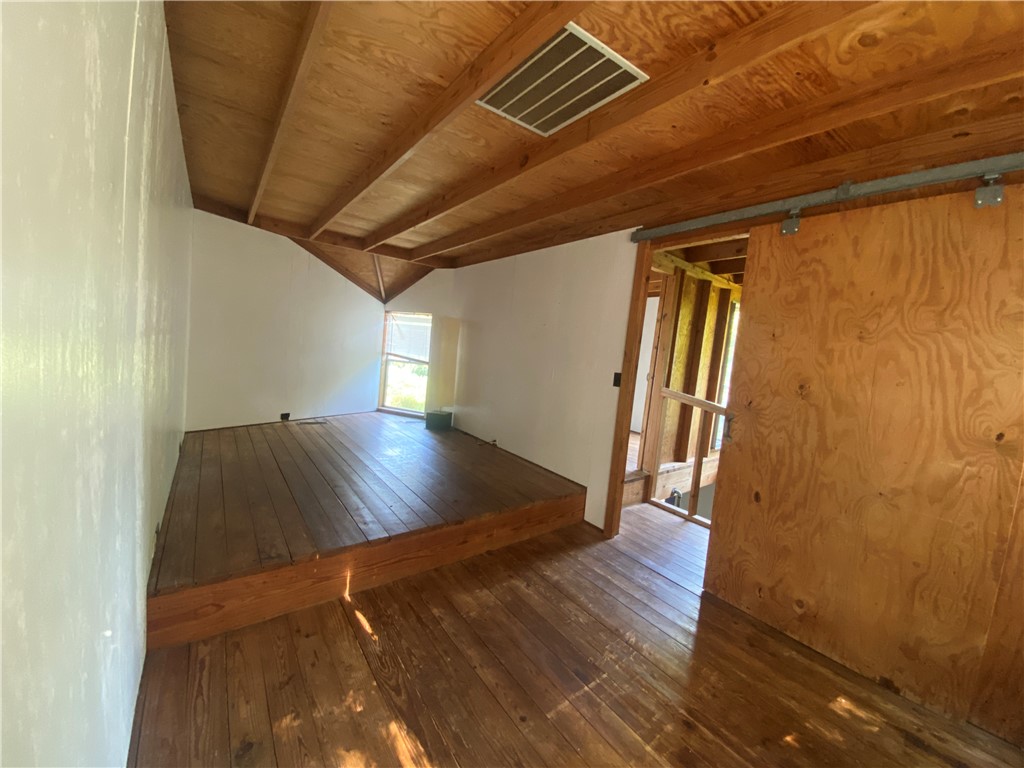 608 West 27th Street Bryan, TX 77803 - Photo 34 of 39 Additional living space with dark wood-style floors