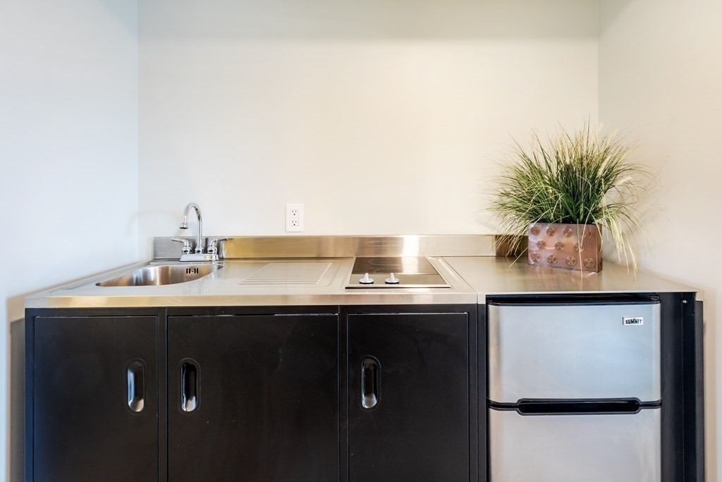 449 Ocean Boulevard, Unit 210 Hampton, NH 03842 - Photo 11 of 13 a sink with a potted plant on it