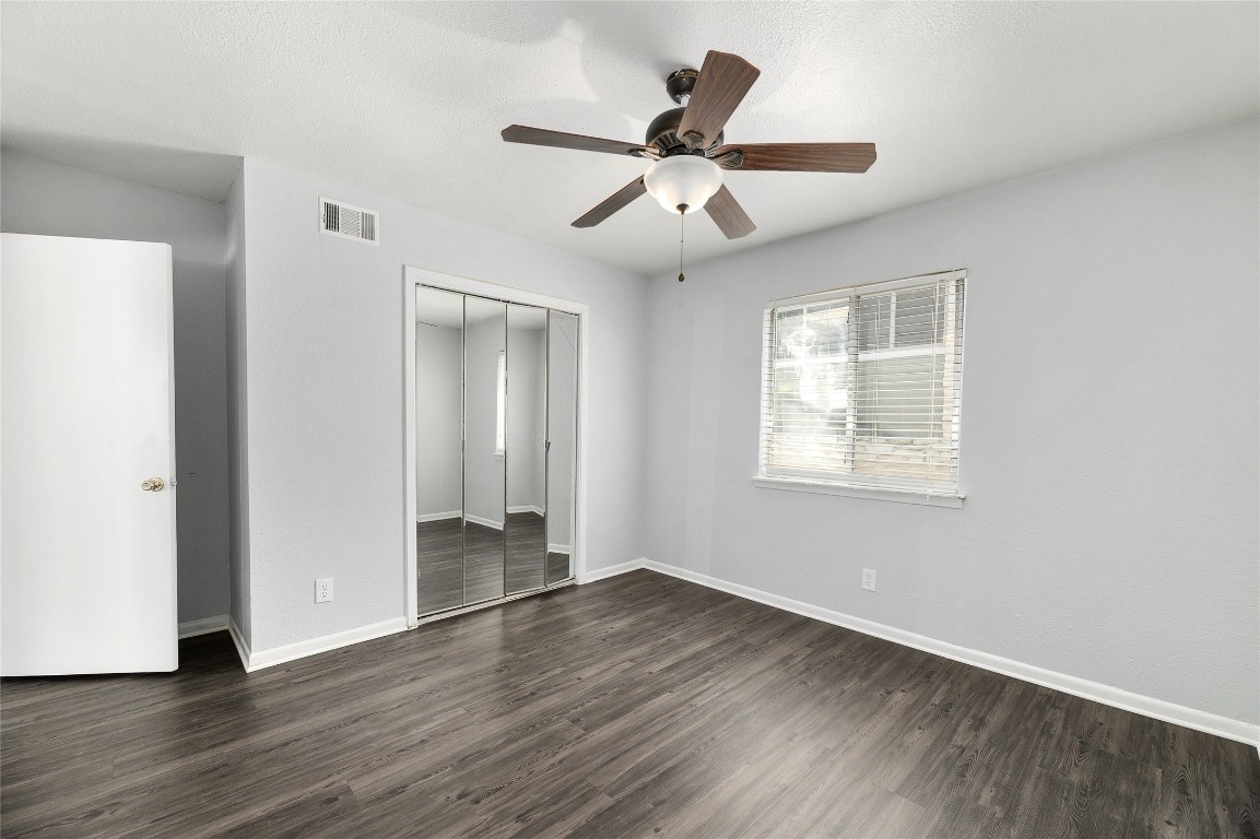 2408 Longview Street, Unit 113 Austin, TX 78705 - Photo 12 of 23 a view of an empty room with wooden floor and a window