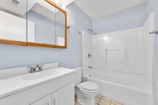 a bathroom with a sink a toilet and a bathtub