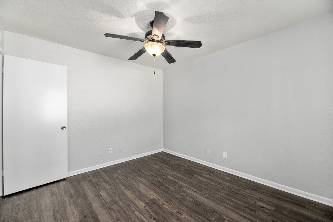 2408 Longview Street, Unit 113 Austin, TX 78705 - Photo 19 of 23 a view of a room with wooden floor and ceiling fan
