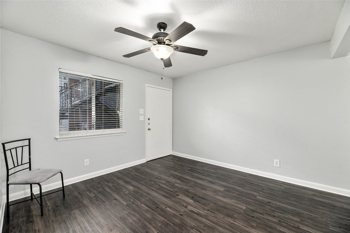 2408 Longview Street, Unit 113 Austin, TX 78705 - Photo 10 of 23 a view of wooden floor and windows in a room