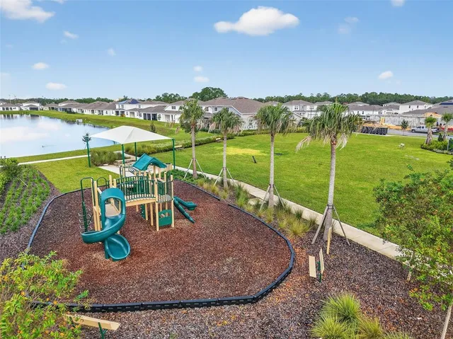 an aerial view of a house with outdoor space