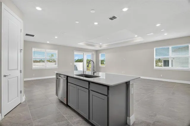 a kitchen with appliances cabinets and furniture