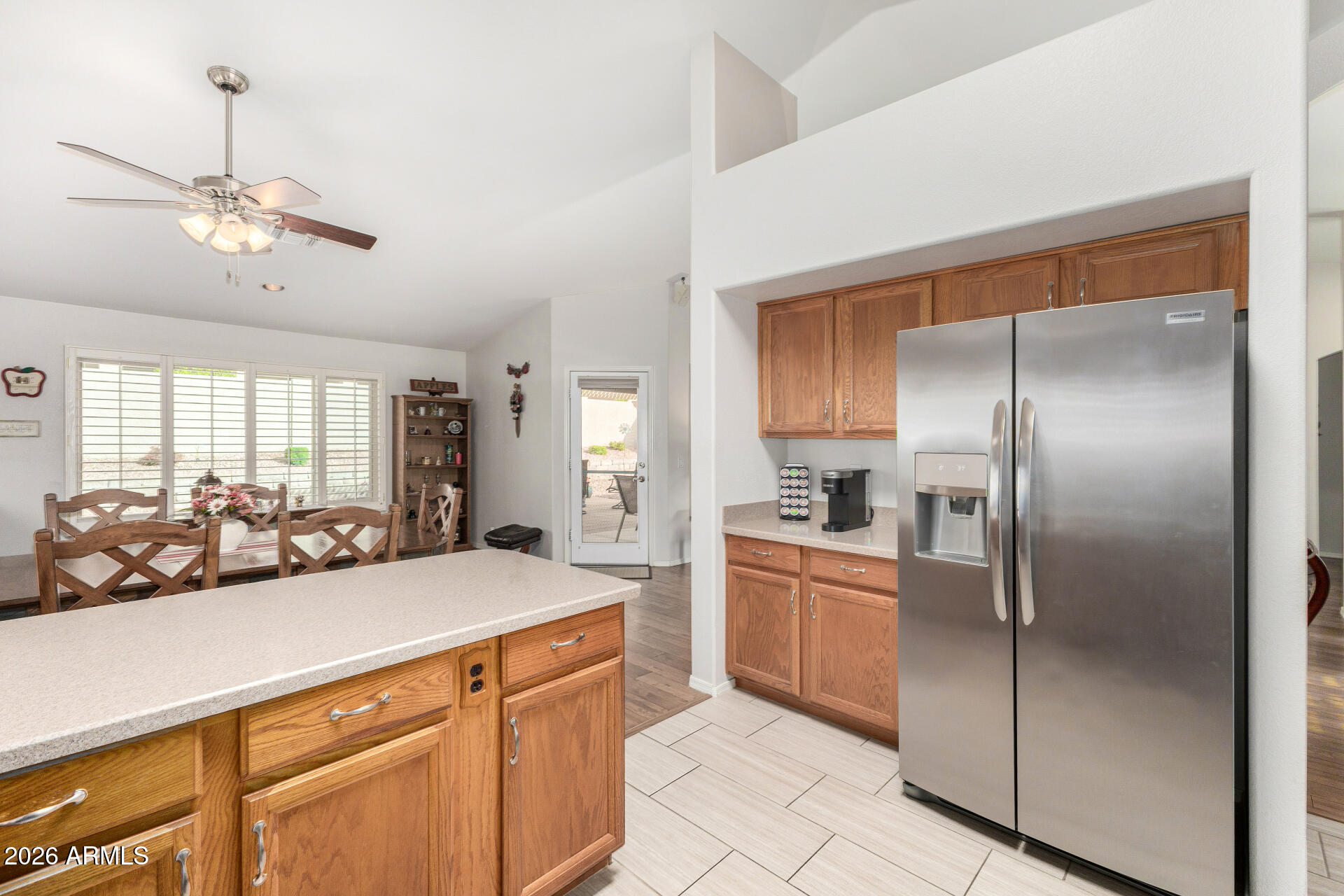 8302 West Marco Polo Road Peoria, AZ 85382 - Photo 11 of 30 a kitchen with stainless steel appliances a sink a refrigerator and cabinets
