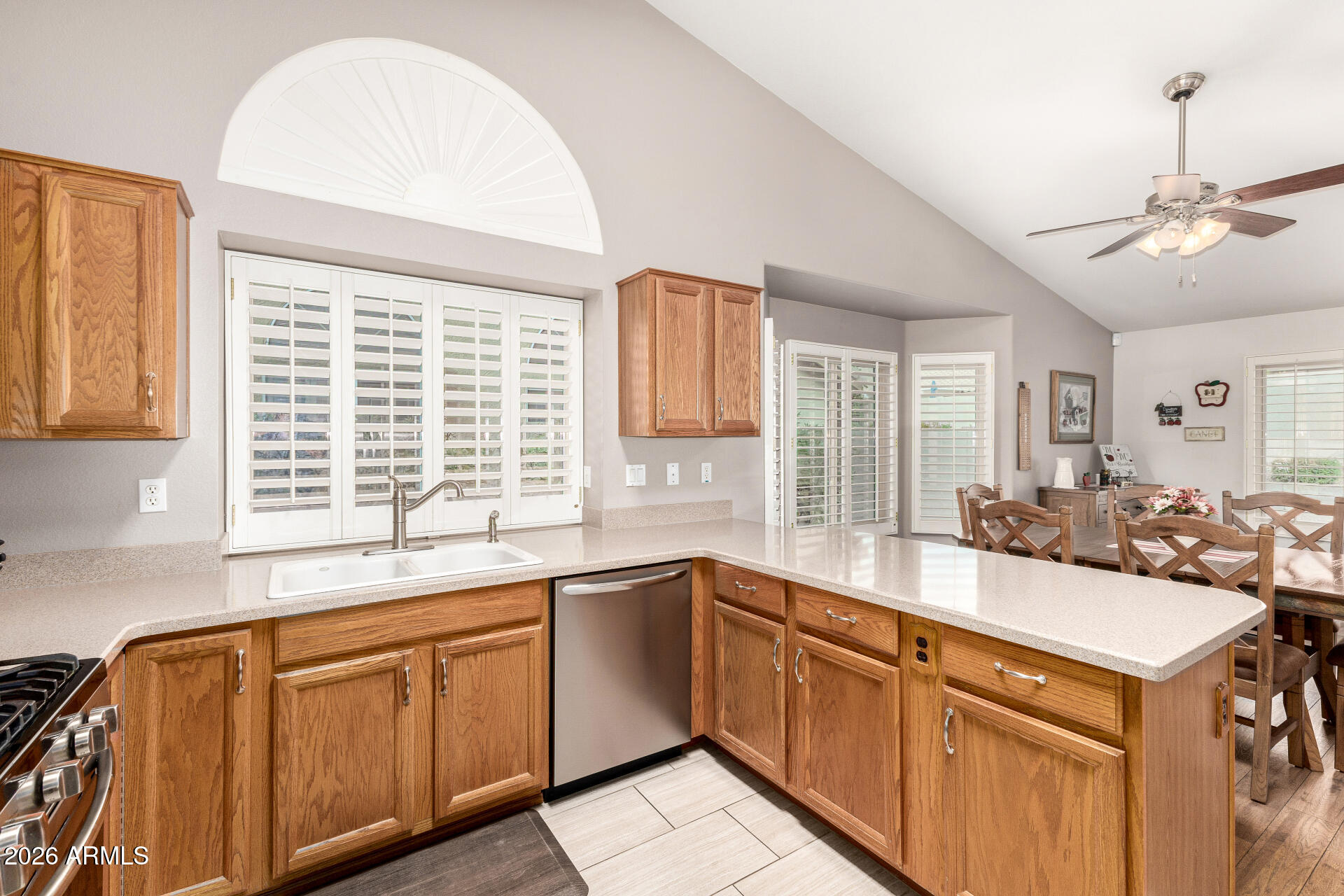 8302 West Marco Polo Road Peoria, AZ 85382 - Photo 12 of 30 a kitchen with a sink stove and cabinets