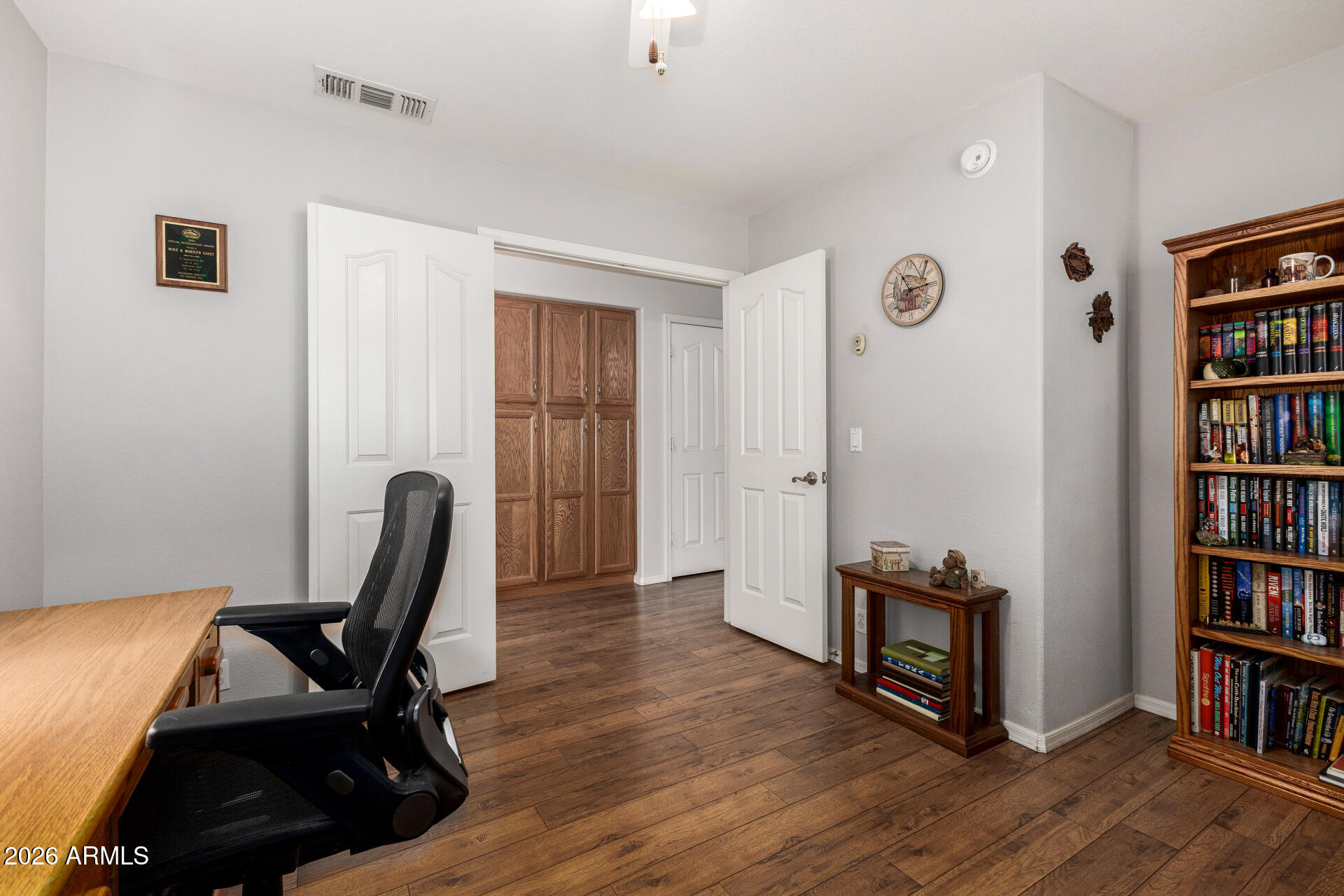 8302 West Marco Polo Road Peoria, AZ 85382 - Photo 14 of 30 a view of a workspace with furniture and wooden floor