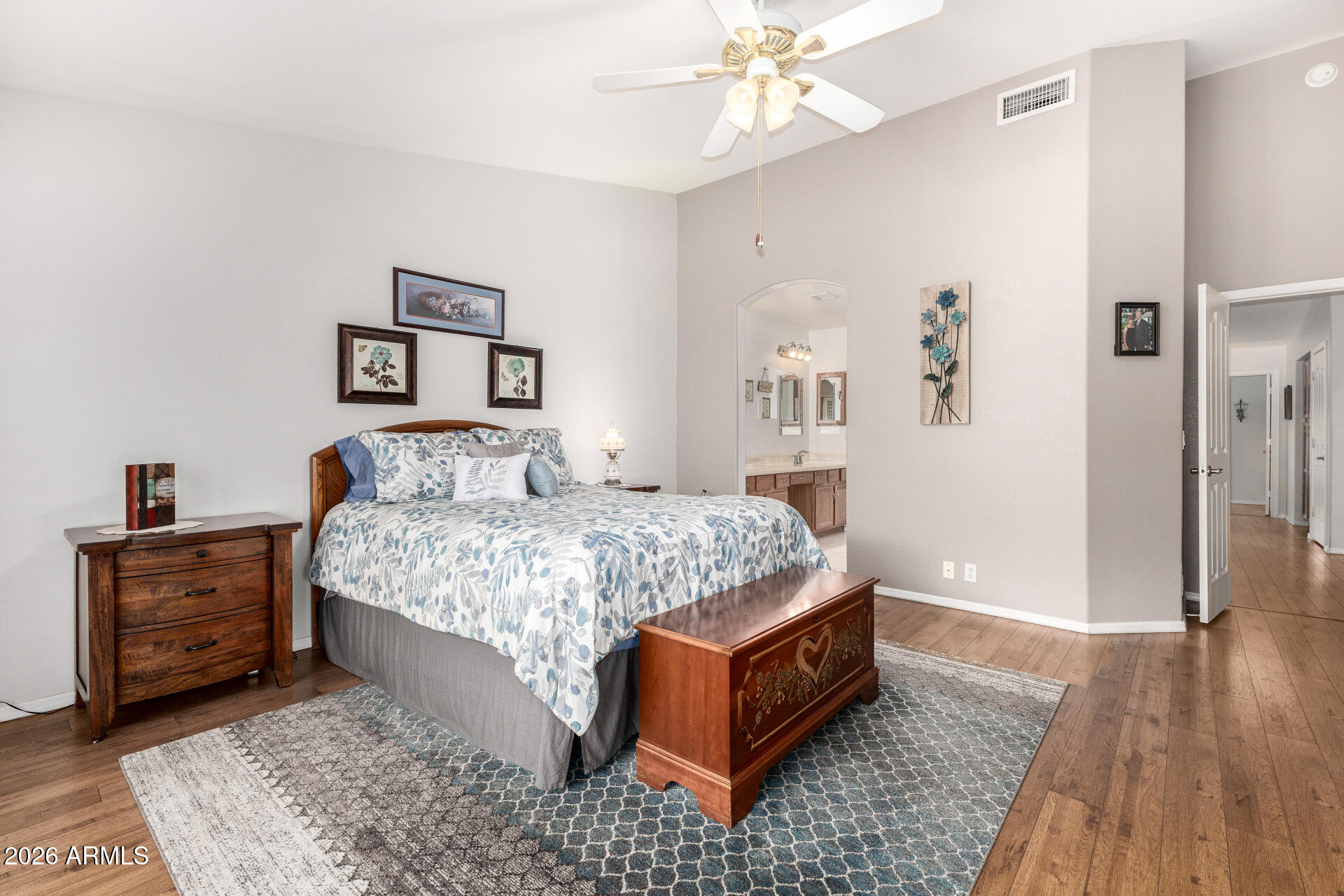 8302 West Marco Polo Road Peoria, AZ 85382 - Photo 16 of 30 a bedroom with a bed and wooden floor