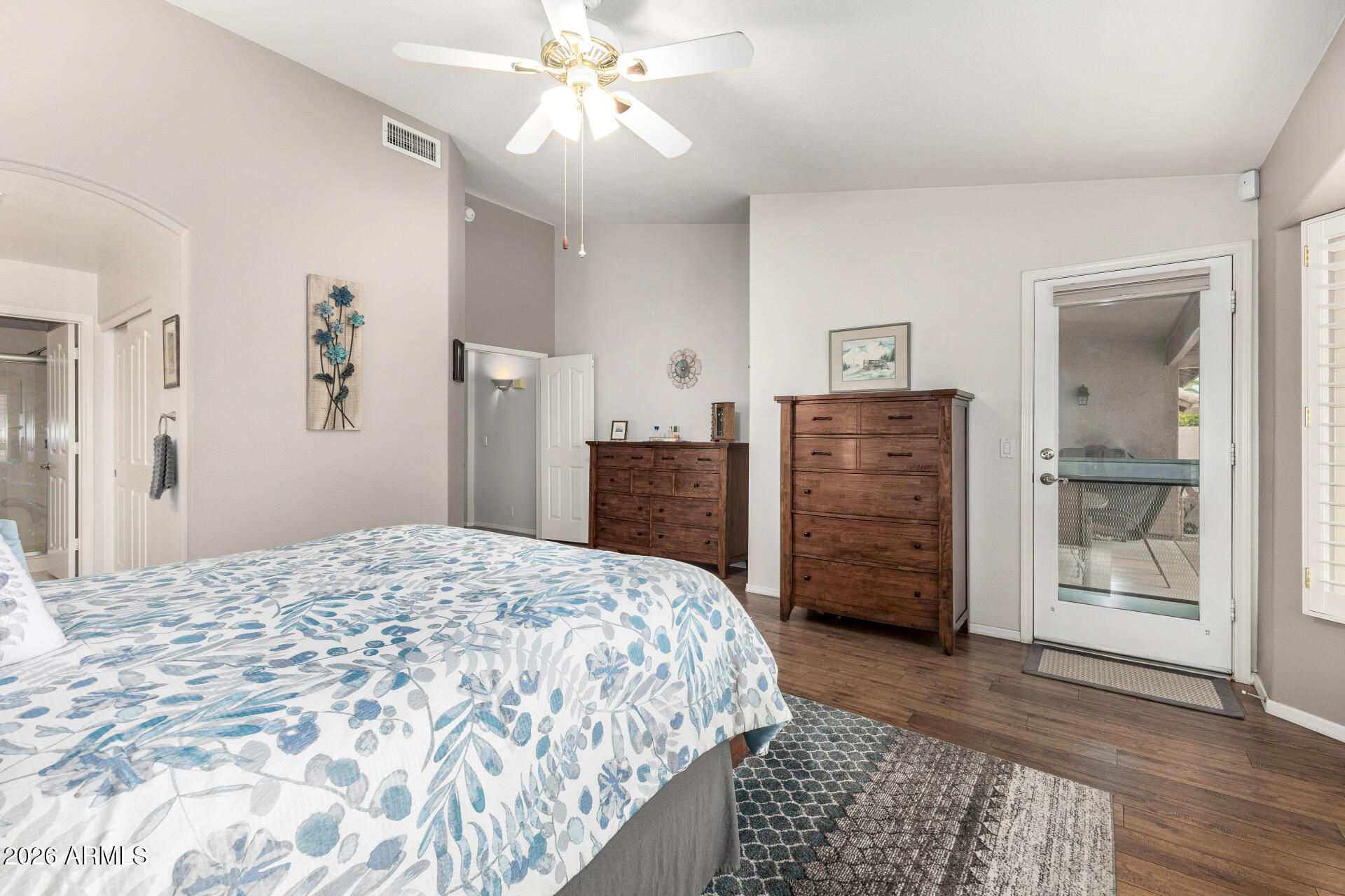 8302 West Marco Polo Road Peoria, AZ 85382 - Photo 17 of 30 a bedroom with a bed and a chandelier