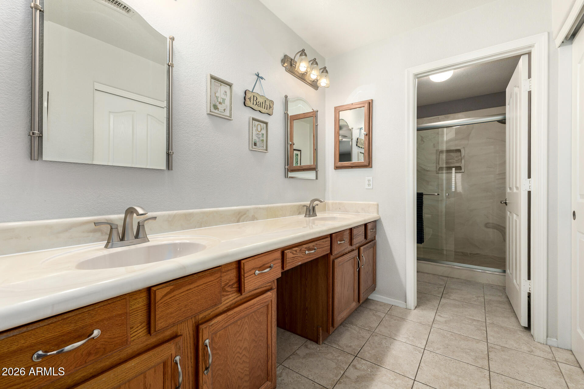 8302 West Marco Polo Road Peoria, AZ 85382 - Photo 18 of 30 a bathroom with a double vanity sink mirror and shower