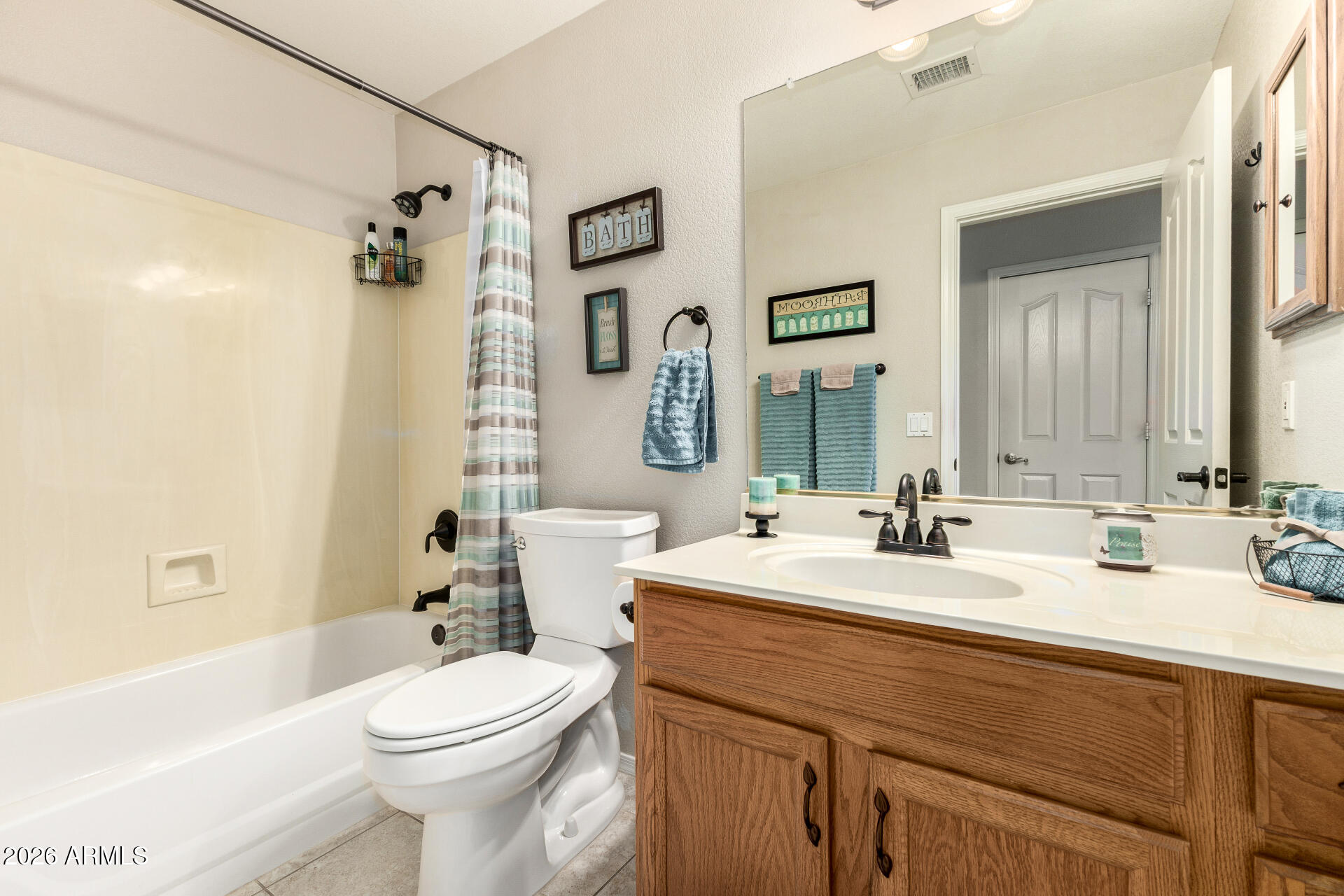 8302 West Marco Polo Road Peoria, AZ 85382 - Photo 23 of 30 a bathroom with a double vanity sink toilet mirror and bathtub