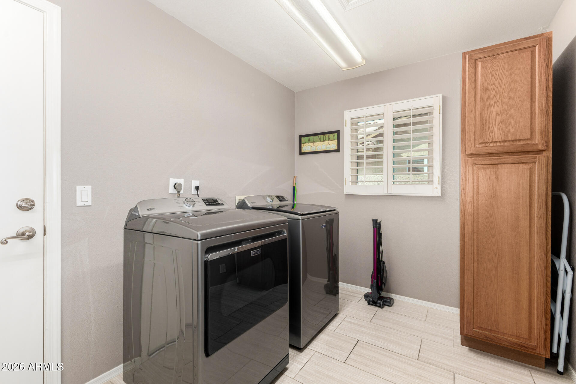 8302 West Marco Polo Road Peoria, AZ 85382 - Photo 24 of 30 a view of a storage and utility room with washer and dryer