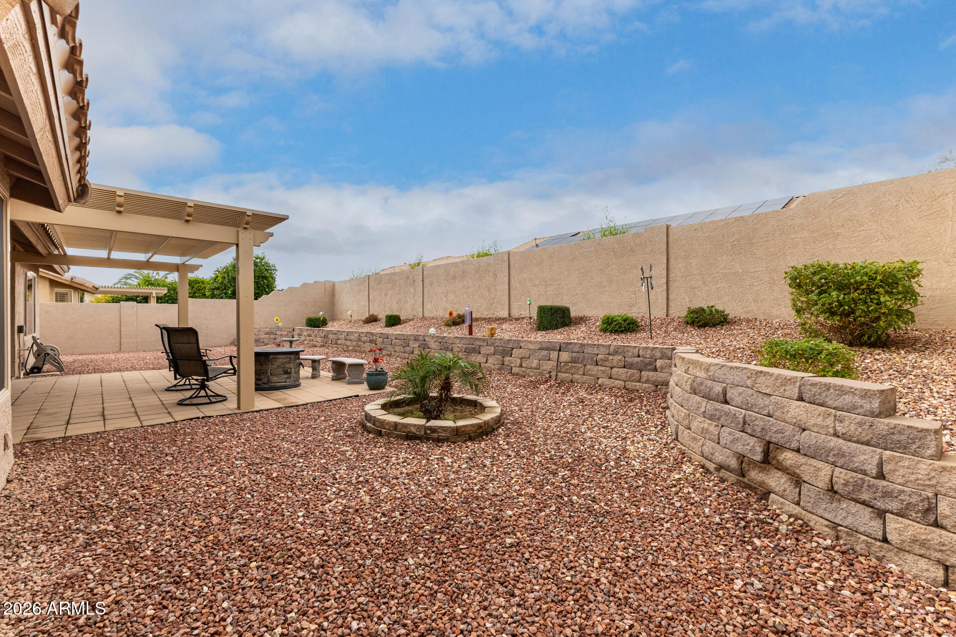 8302 West Marco Polo Road Peoria, AZ 85382 - Photo 28 of 30 a view of a backyard with table and chairs