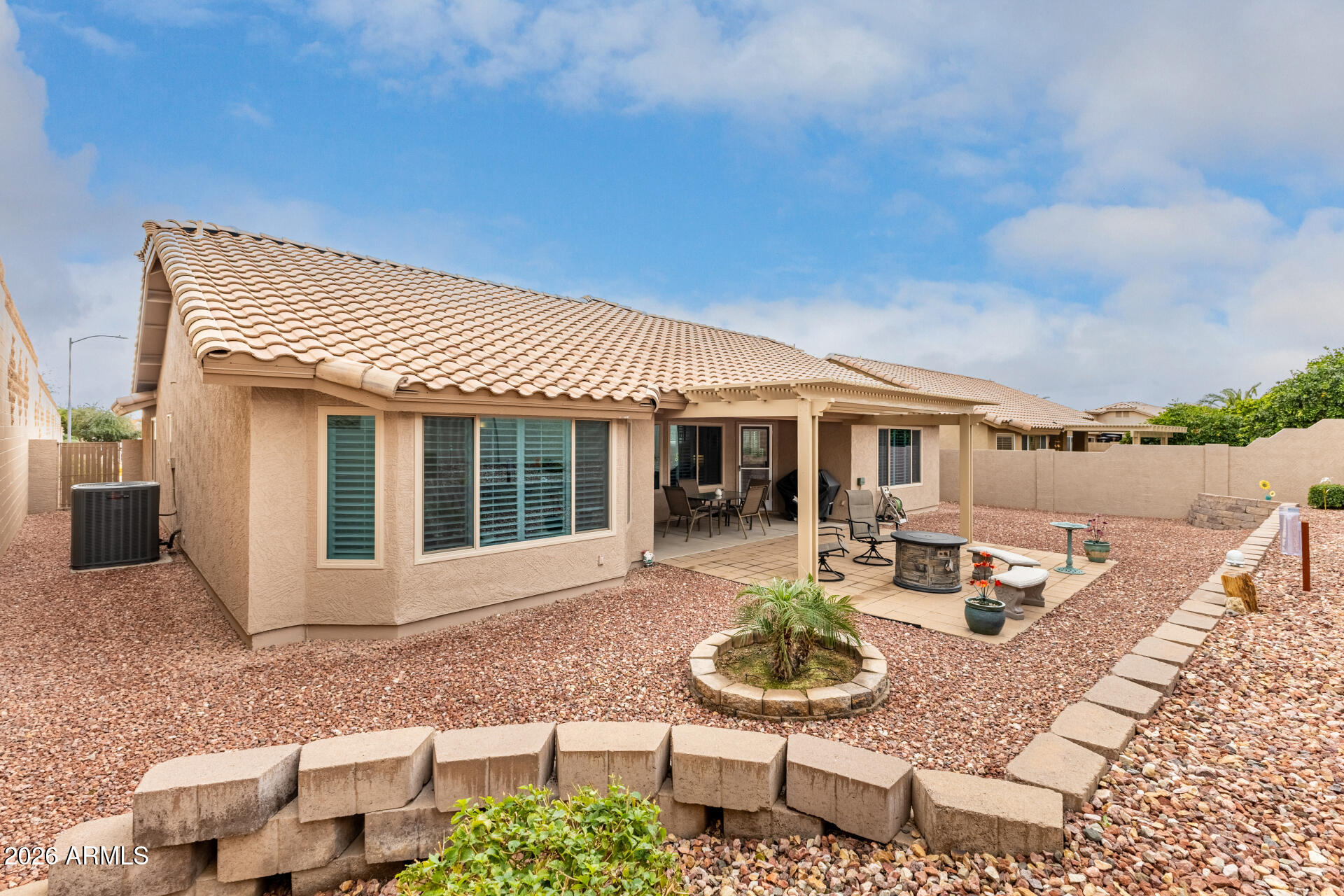 8302 West Marco Polo Road Peoria, AZ 85382 - Photo 30 of 30 a view of a house with backyard sitting area and garden