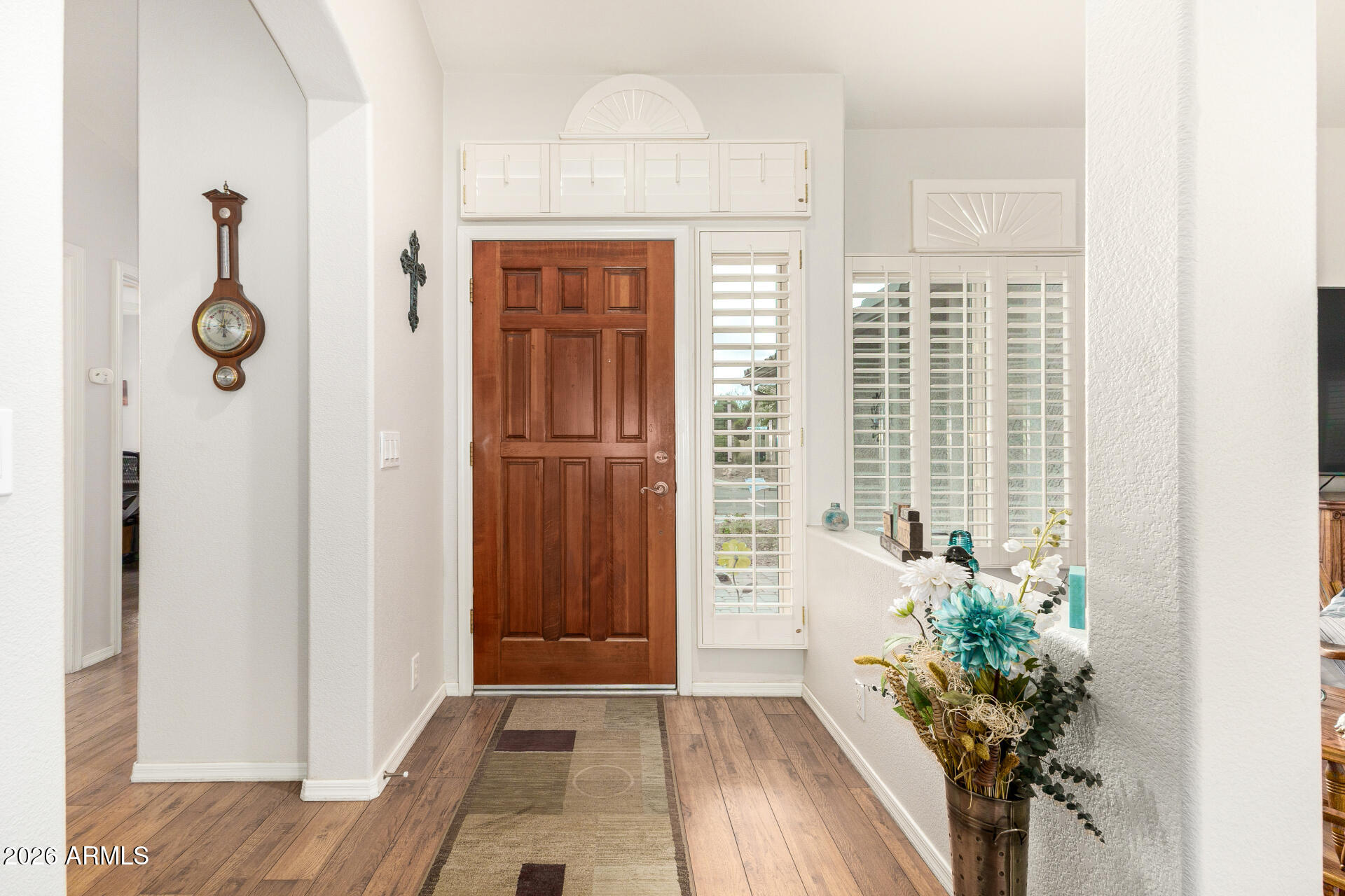 8302 West Marco Polo Road Peoria, AZ 85382 - Photo 3 of 30 a view of a entryway with wooden floor