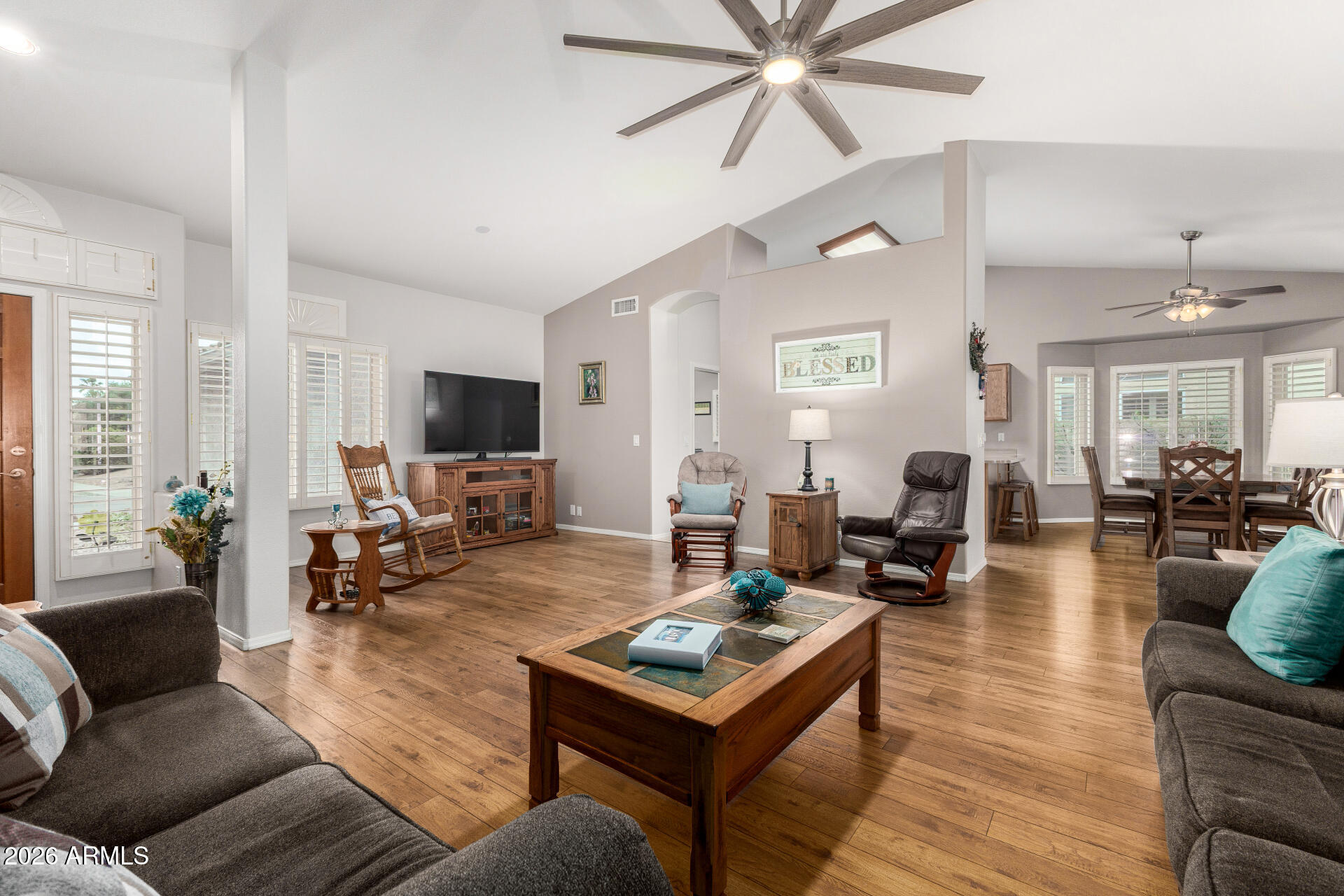 8302 West Marco Polo Road Peoria, AZ 85382 - Photo 5 of 30 a living room with furniture and a flat screen tv