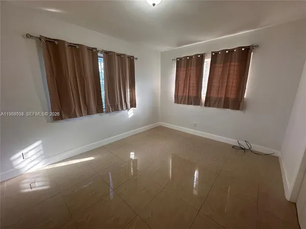 a view of an empty room with stairs