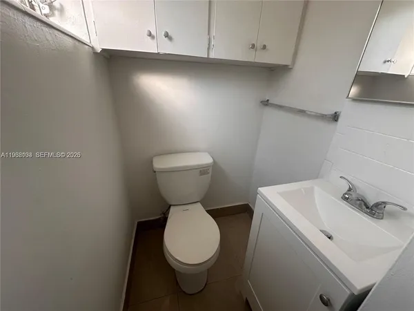 a bathroom with a sink toilet and vanity