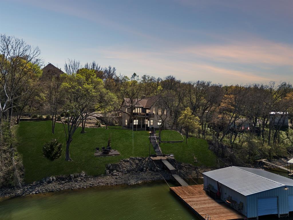 an aerial view of a house with a garden