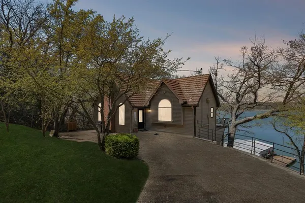 a front view of a house with garden