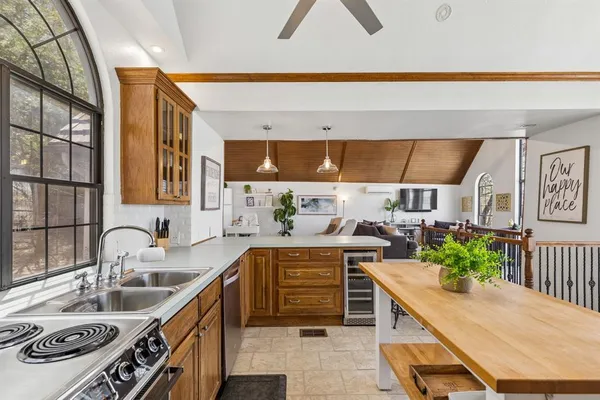 a kitchen with a sink and a stove top oven